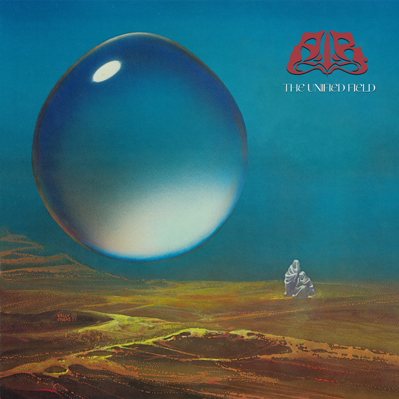 The album cover for The Unified Field by All India Radio features a landscape under a deep blue sky, dominated by a massive, reflective sphere hovering above the ground. Two small, robed figures stand below it, gazing upward. The band’s name and title appear in the upper right corner.