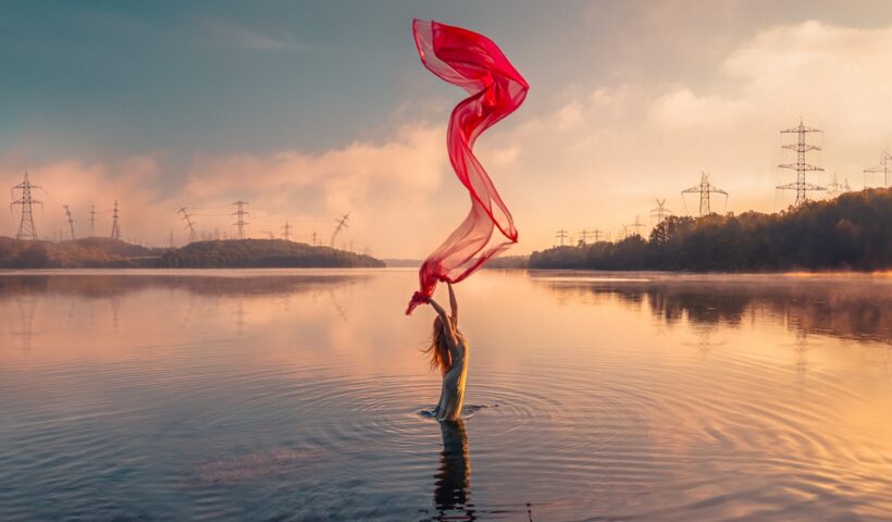 Amarok – "Hope" cover artwork. A landscape with a large body of water and a red plume coming from the middle.