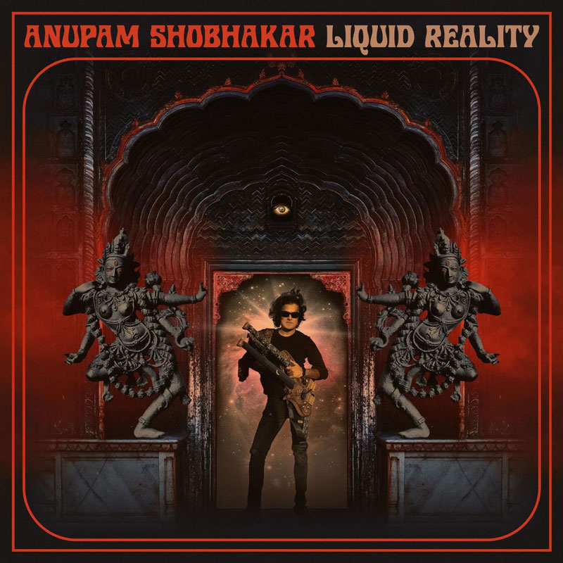 The album cover for Liquid Reality by Anupam Shobhakar features a central figure, presumably Shobhakar, who stands in a cosmic portal, clad in black and holding an intricately designed electric instrument. Framing the scene is an ornate, temple-like archway with intricate carvings, steeped in deep reds and blacks, evoking a sense of ancient grandeur. Two multi-armed goddess-like statues flank the entrance. Above, a single eye watches from within the arch.