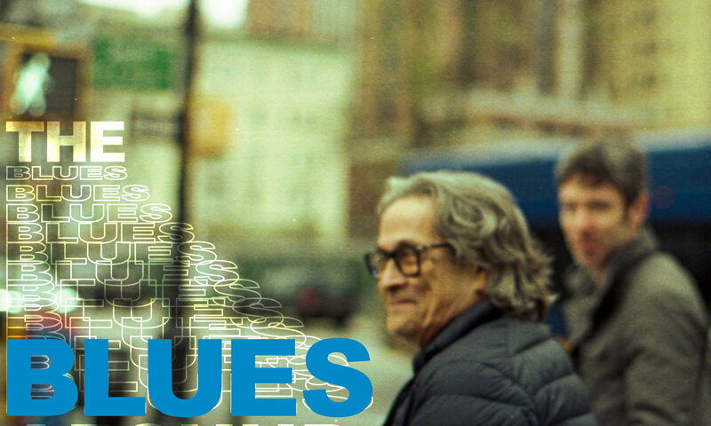 Chano Domínguez, Ethan Margolis - The Blues Around Us cover arkwork. A photo of the two artists in an urban environment. Margolis looks blurry.