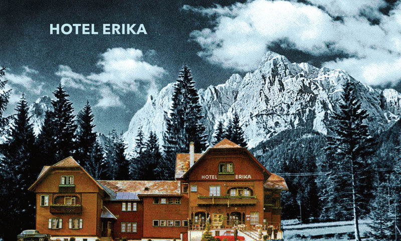 Daniel Biro - Hotel Erika cover artwork. A photo of Hotel Erika with trees and the Alps mountains in the background..