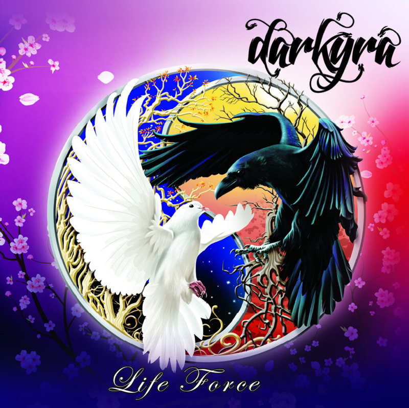 The album cover for Life Force by Darkyra features an illustration of a white dove and a black raven locked in a dynamic, circular dance. Set against a radiant background that shifts from soft pinks to deep purples and reds, the imagery is framed by intertwining branches and cosmic elements. The band’s name appears in a bold, calligraphic script in the top right, while the album title is written below in cursive.