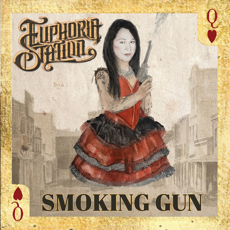 The Smoking Gun album cover by Euphoria Station resembles a vintage playing card, specifically the Queen of Hearts. It features a hand-drawn portrait of a woman in a red and black saloon-style dress holding a smoking revolver. The band’s logo appears in ornate lettering at the top left, while the album title sits boldly at the bottom. A faded Old West town serves as the backdrop.