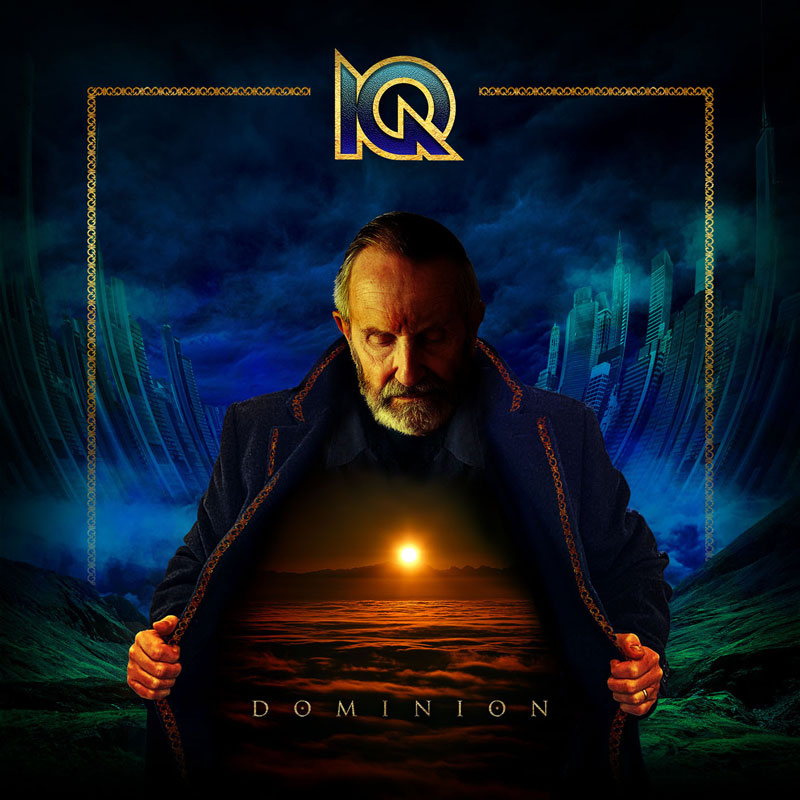 IQ's Dominion album cover features at the center an older man with a stern expression and a trimmed beard. He opens his dark, ornate coat to reveal a glowing scene within—a vast, otherworldly landscape illuminated by a golden sunset over a sea of clouds. The background contrasts futuristic cityscapes with ominous stormy skies. The band's logo appears at the top in gold, while the album title, Dominion, is subtly placed within the illuminated scene on his chest.