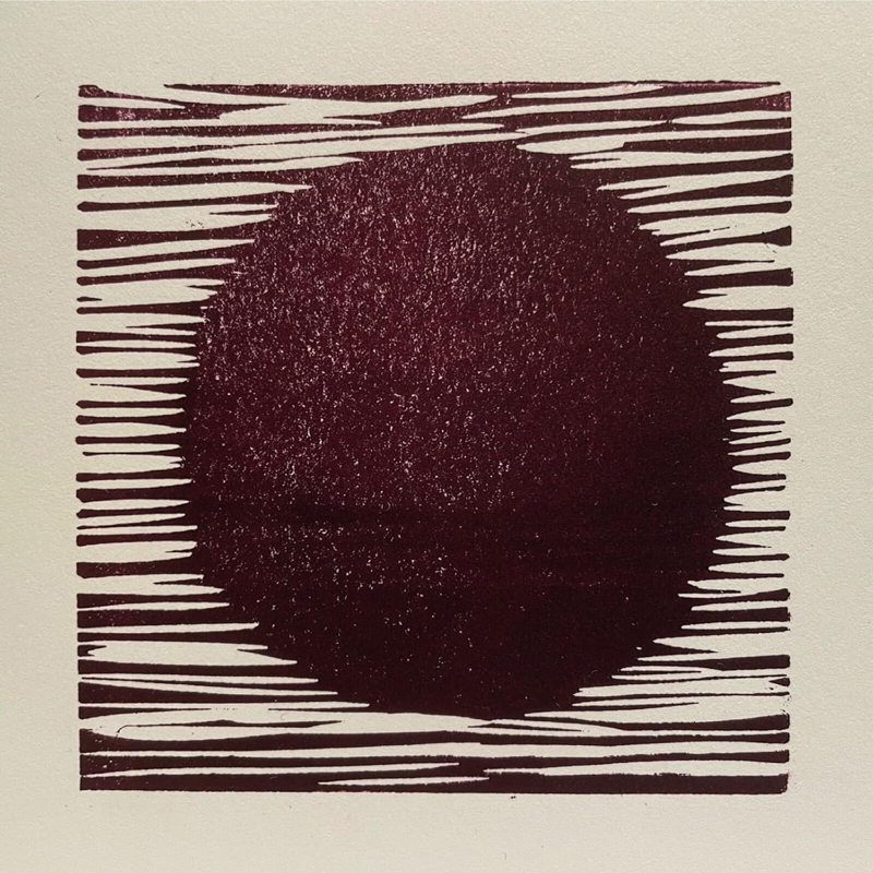 The cover of Transmissions by Ian Boddy & Erik Wøllo features a deep maroon circle centered against a pale background. Sharp horizontal lines extend from the circle’s edges