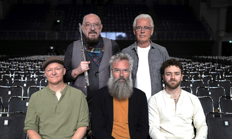 Jethro Tull band photo posing inside as theater.