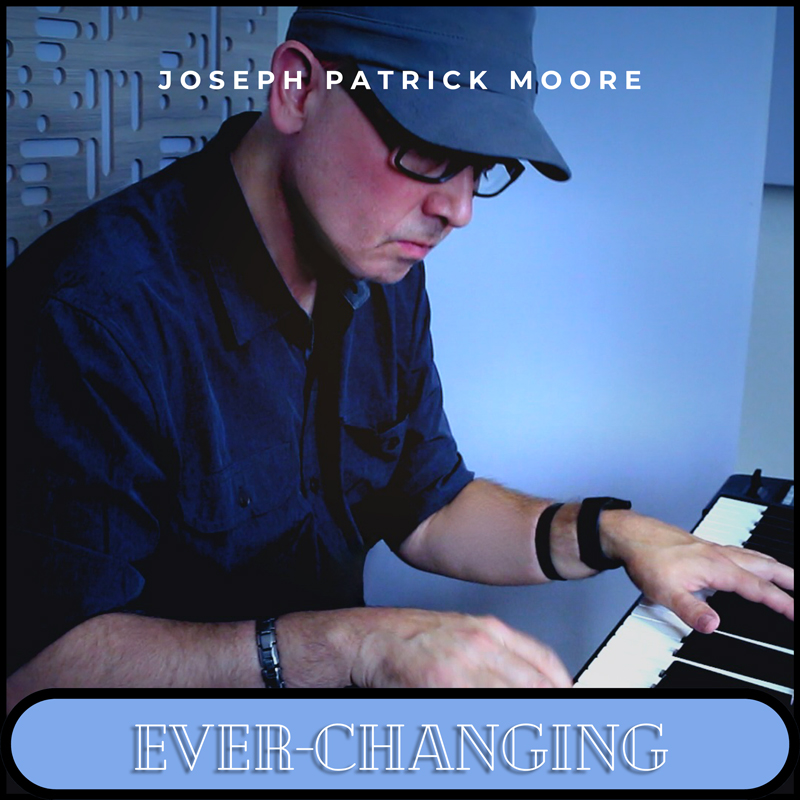 Joseph Patrick Moore - Ever-Changing single artwork. A photo of Moore playing piano.