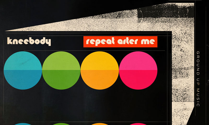 The album cover for Repeat After Me by Kneebody features a modernist design with a black background. The artwork includes six colorful, bisected circles arranged in two rows, using blue, green, yellow, orange, and pink hues. The typography is retro-futuristic: "kneebody" appears in lowercase, cream-colored letters, while "repeat after me" is set in a red rectangle with rounded white text. A geometric, textured white shape extends from the right side. The right edge also features the text "GROUND UP MUSIC," indicating the record label.