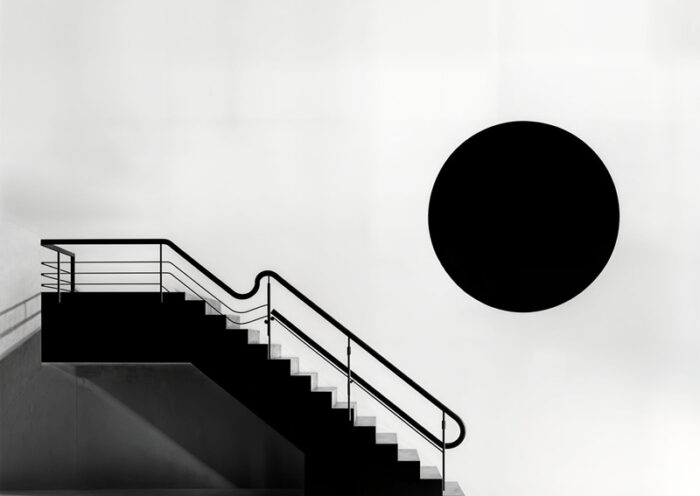 Malcolm Galloway – Stare cover artwork. A black and white side view of a staircase with railings.