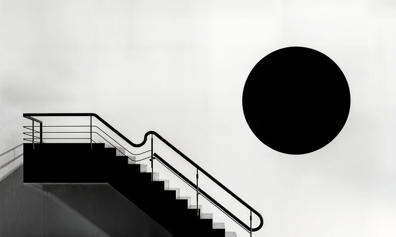 Malcolm Galloway – Stare cover artwork. A black and white side view of a staircase with railings.