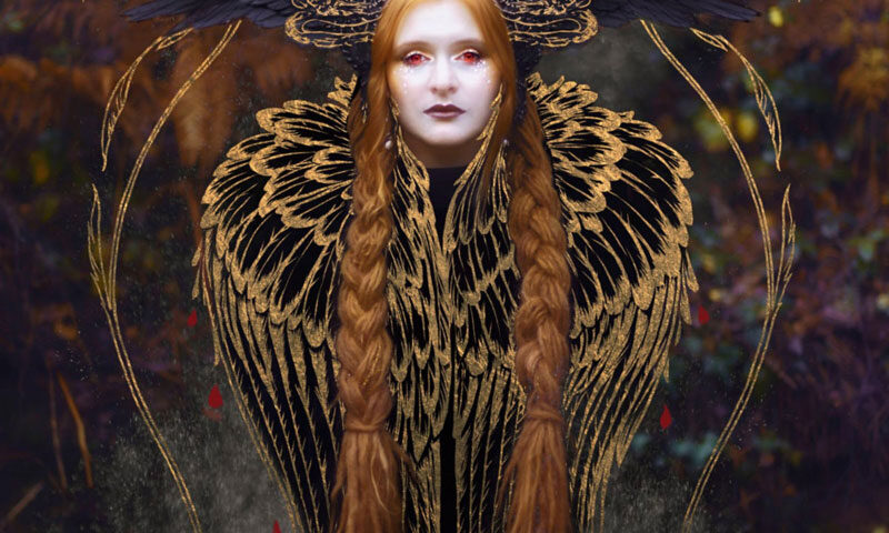 Marjana Semkina Sirin cover artwork. an image of the artist with red eyes, two long hair braids and a golden feather shawl.