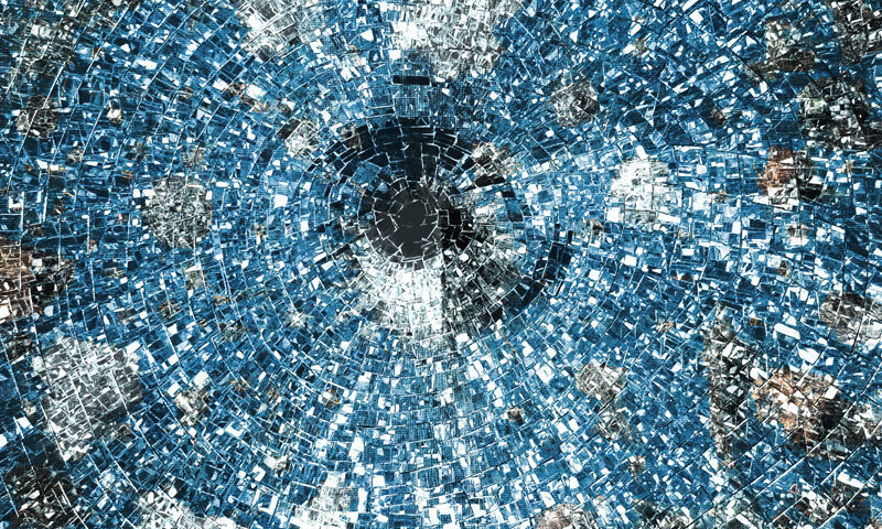 The album cover for Sky on the Ground by Markus Reuter and Stefano Castagna features a circular, mosaic-like design resembling a shattered mirror or digital vortex. Shades of blue, silver, and white dominate the image.
