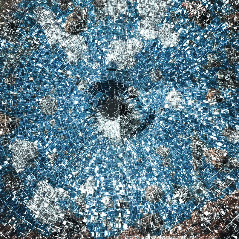 The album cover for Sky on the Ground by Markus Reuter and Stefano Castagna features a circular, mosaic-like design resembling a shattered mirror or digital vortex. Shades of blue, silver, and white dominate the image.