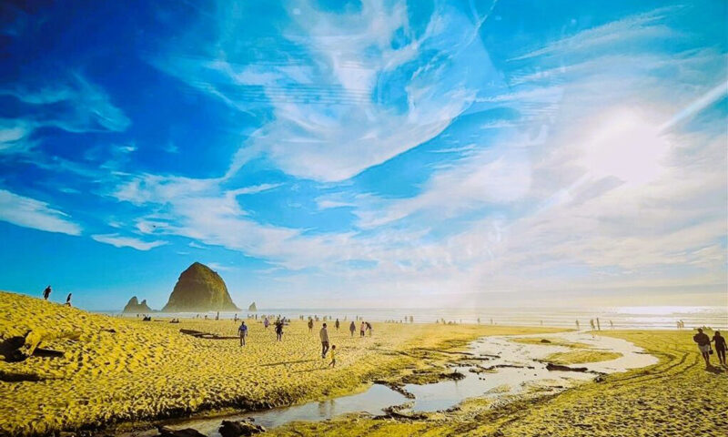 The album cover for The Next Dream by Massimo Pieretti features a beachscape under a dramatically painted sky. Swirling clouds stretch across a deep blue sky. The artist’s name and album title appear in clean, white, all-caps font near the bottom.