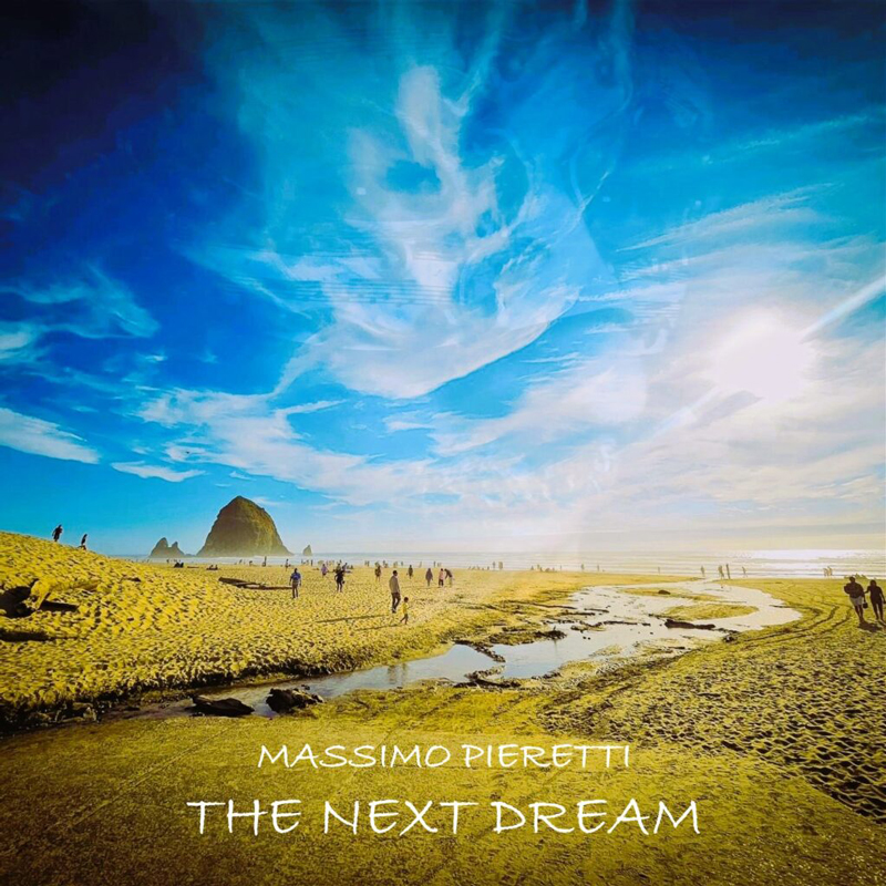 The album cover for The Next Dream by Massimo Pieretti features a beachscape under a dramatically painted sky. Swirling clouds stretch across a deep blue sky. The artist’s name and album title appear in clean, white, all-caps font near the bottom.