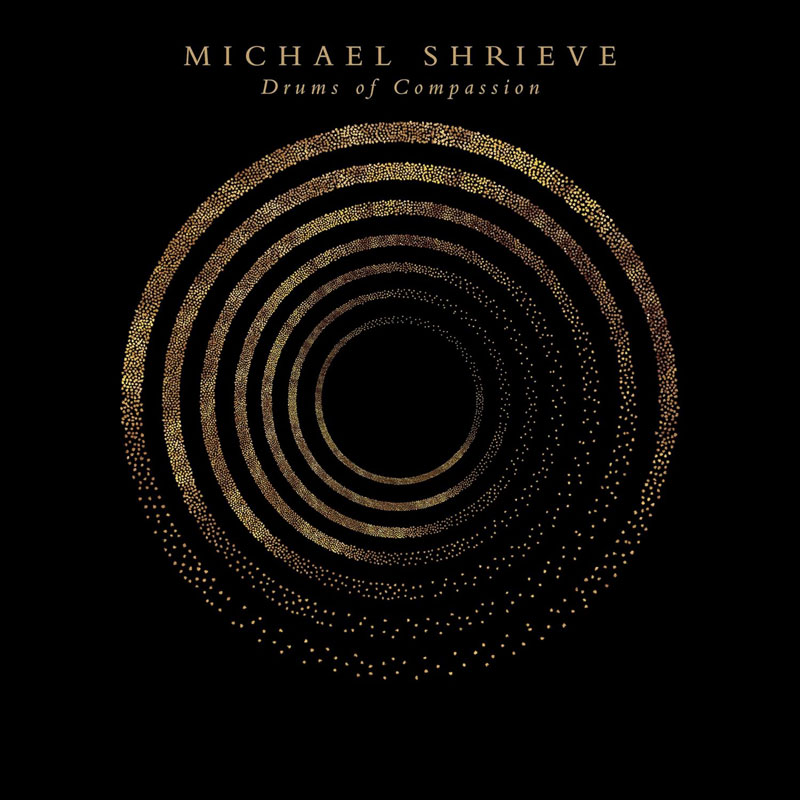 Michael Shrieve – Drums of Compassion cover artwork. Concentric golden circles over a black background.