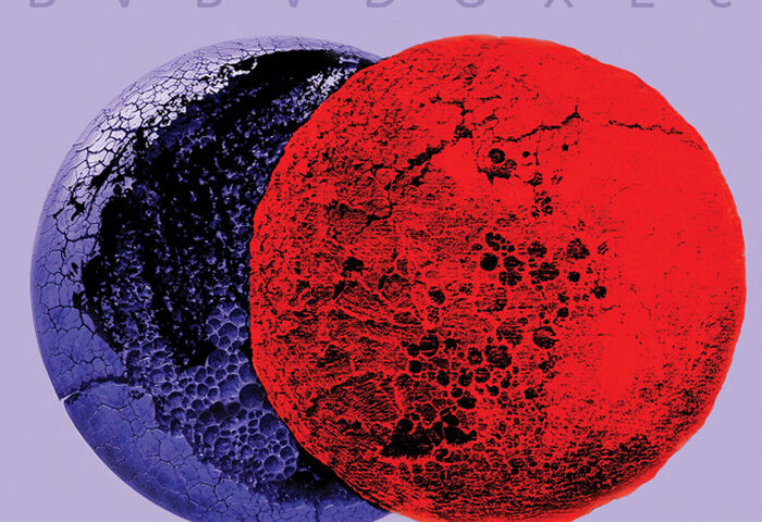 Miguel Kertsman — Paradoxes cover artwork. A cover featuring two overlapping, heavily textured spheres, one dark blue-purple and one vivid red, against a pale lavender background. “PARADOXES” appears in spaced blue lettering above, with “MIGUEL KERTSMAN” in red below.