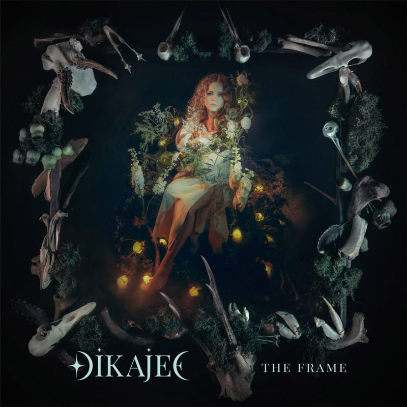 Olga Dikajee Karpova – The Frame cover artwork. Olga surrounded by shamanic symbols, including animal skulls.