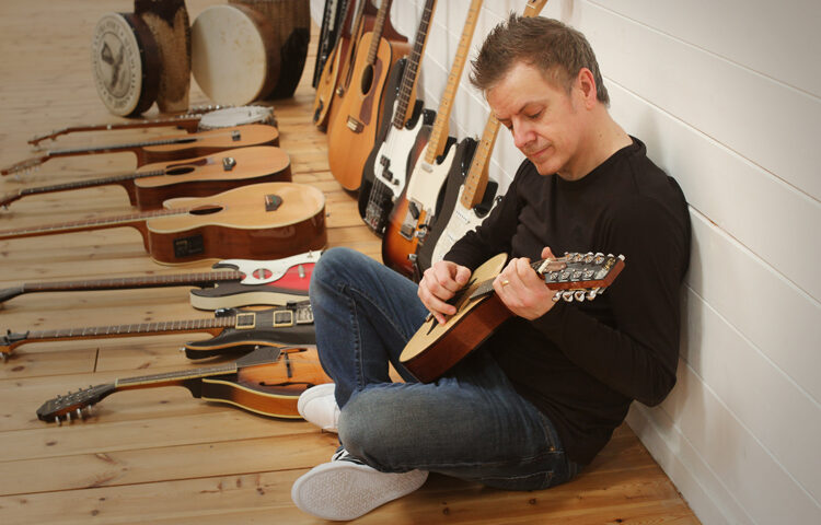 Robert Reed with guitar colection