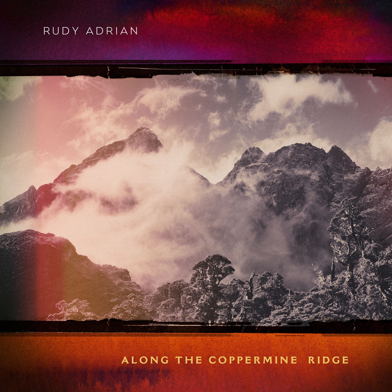 A misty mountain range rises through swirling clouds, framed by deep red and purple borders. The artist’s name appears at the top in white lettering, while the title Along The Coppermine Ridge sits centered at the bottom in golden text.
