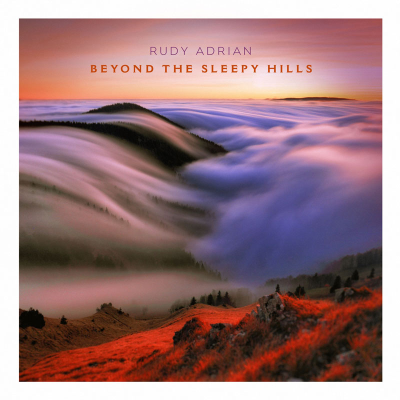 This album cover for Beyond the Sleepy Hills by Rudy Adrian features a breathtaking landscape with a surreal, dreamlike atmosphere. A vivid red foreground contrasts with a misty expanse of rolling hills, where fog flows like cascading waves under a soft, glowing sunset or sunrise.