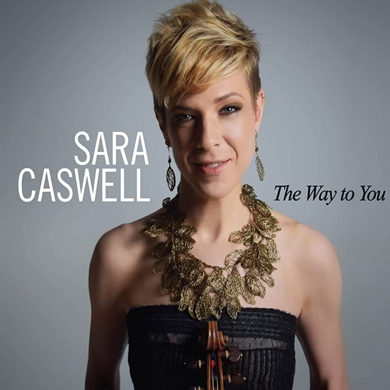 Sara Caswell — The Way To You cover artwork. A photo of Caswell holding a violin to her chest.