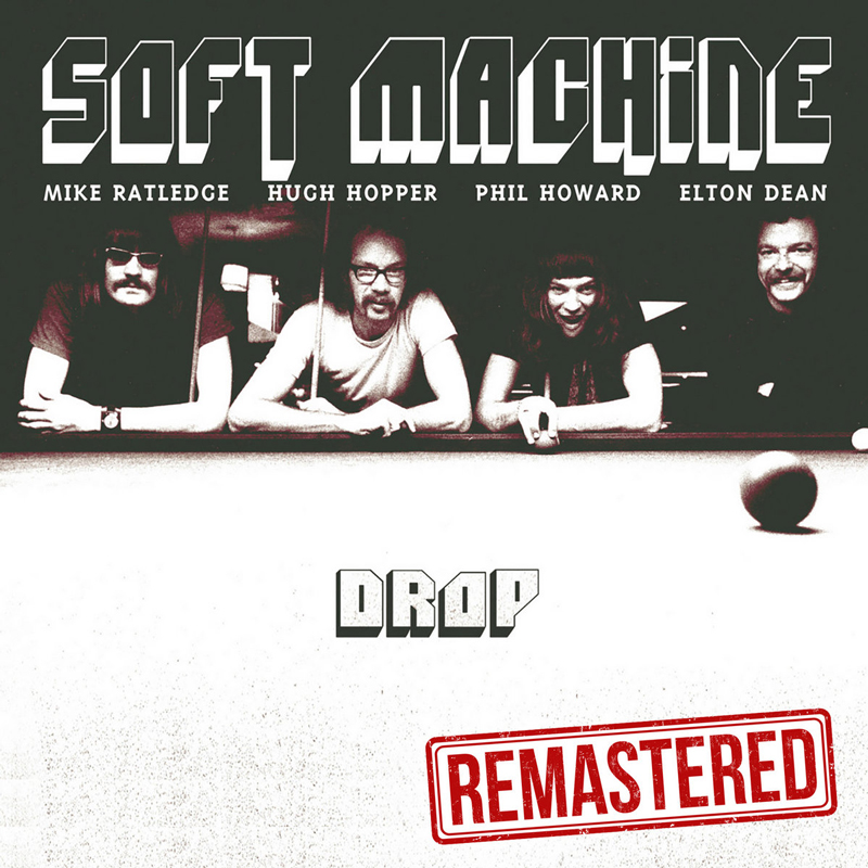 The album cover for Drop (Remastered) by Soft Machine features a black-and-white photo of the band members—Mike Ratledge, Hugh Hopper, Phil Howard, and Elton Dean—leaning over a pool table. The band's name appears at the top in bold lettering, with each member's name below it. The title Drop is centered in a minimalist font, while a red "Remastered" stamp appears below.
