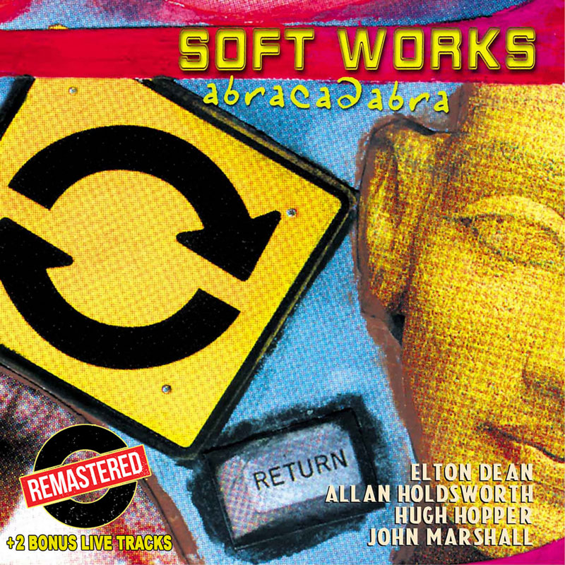 The album cover for Abracadabra by Soft Works features a collage-style design with contrasting imagery. A large yellow road sign with a circular arrow dominates the left side. Below it, a keyboard "Return" key is embedded in the composition. On the right, part of a golden Buddha face. The title "Soft Works" appears in bold yellow uppercase letters at the top, with the word "abracadabra" in blue cursive beneath it. The bottom right lists band members: Elton Dean, Allan Holdsworth, Hugh Hopper, and John Marshall. A sticker announces the remastering and two bonus live tracks.