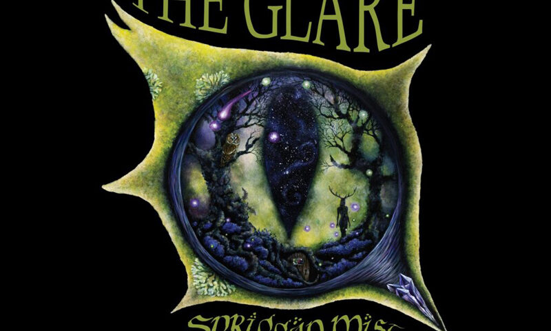 The cover of The Glare by Spriggan Mist features a circular portal framed in green, opening onto a forest scene with twisted trees, glowing orbs, a stag, and a starry night sky. The band’s name appears in ornate lettering at the bottom, while the album title arches above in green type against a black background.