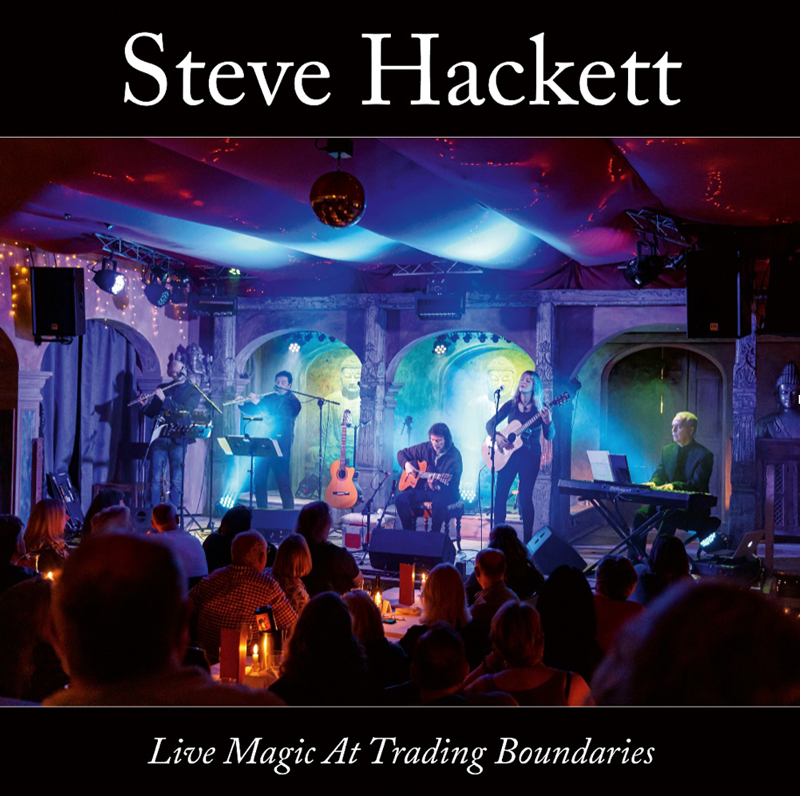 Steve Hackett Live Magic At Trading Boundaries cover artwork. A color photo of Hackett and his band playing live.