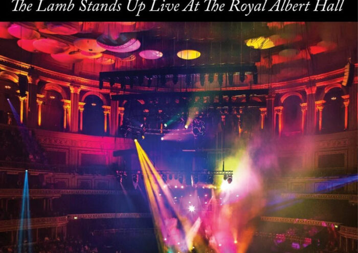 The album cover for The Lamb Stands Up Live at the Royal Albert Hall features a wide-angle photo of Steve Hackett's live performance at the iconic venue. Bathed in multicolored stage lights and surrounded by the ornate architecture of the Royal Albert Hall. The artist's name and album title appear in classic serif font against a black header.