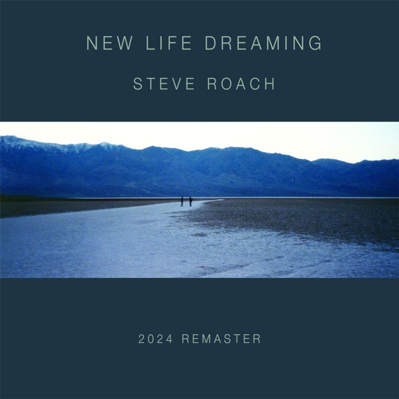 The album cover for New Life Dreaming (2024 Remaster) by Steve Roach features a landscape photograph of a vast, desolate plain with two distant figures walking along a narrow water path. A mountain range looms in the background under a pale sky.