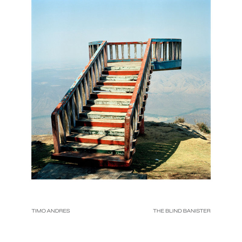 Timo Andres - The Blind Banister cover artwork. It shows wooden stairs that lead to a wooden deck floating in the air.