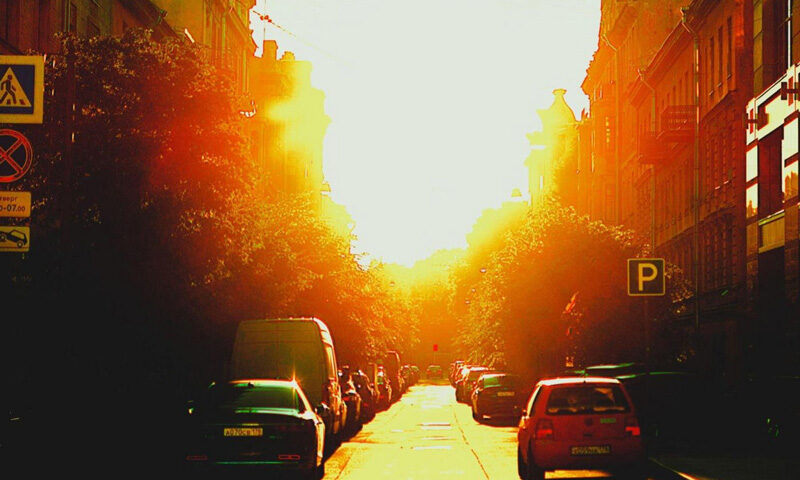 Volker Lankow - Thermal Drift cover artwork. A photo of a city street with a very bright sun in the middle.
