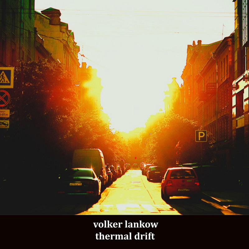 Volker Lankow - Thermal Drift cover artwork. A photo of a city street with a very bright sun in the middle.
