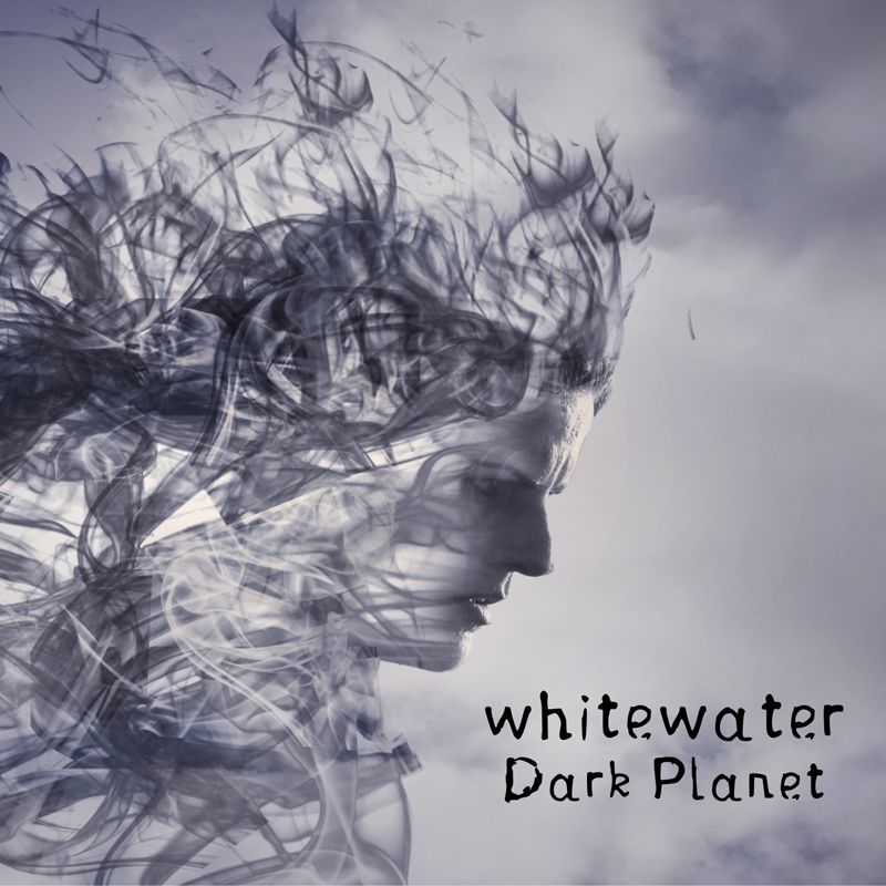 The album cover for Dark Planet by Whitewater depicts a grayscale profile of a human face, seemingly dissolving into swirling smoke or mist, blending seamlessly with the cloudy background.