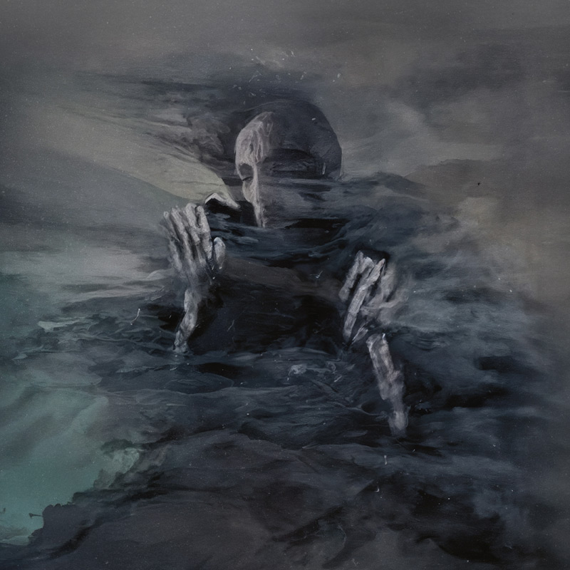 The album cover features a ghostly, skeletal figure emerging from a swirling mass of dark, smoky forms, with both hands raised near its chest. Rendered in shades of charcoal, gray, and blue-green.