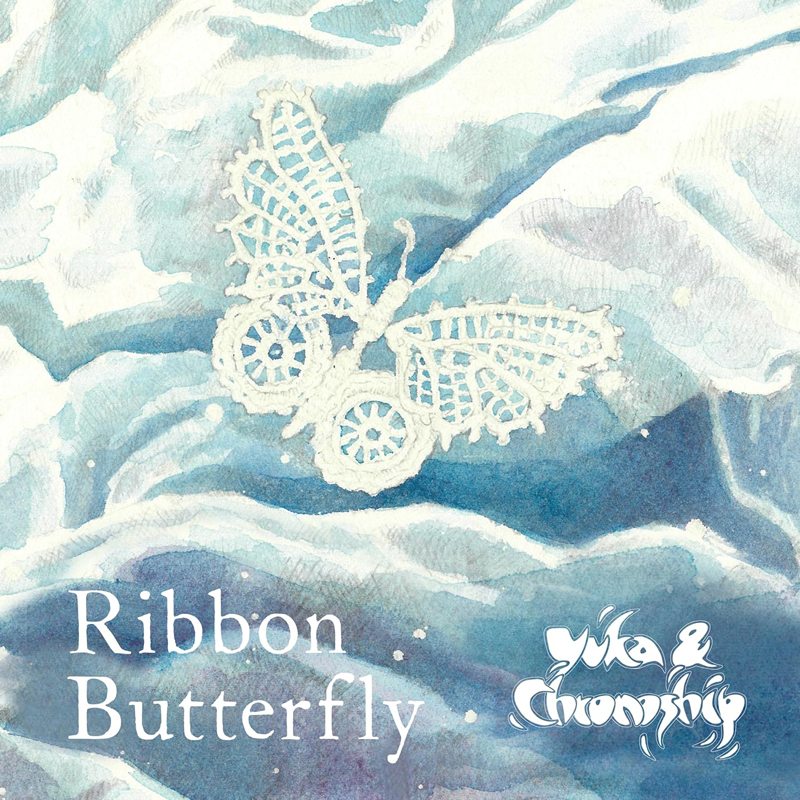 The album cover for Ribbon Butterfly by Yuka & Chronoship features a lace-like butterfly set against a watercolor backdrop of swirling blues and whites. The band’s name appears in a stylized, organic font in the lower right corner, while the album title is set in serif type on the left.