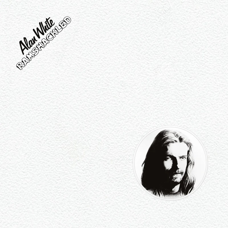 The cover of Ramshackled is a white, textured background with only two key elements, a small circular black-and-white portrait of Alan White in the bottom right, and the album title with his name in black lettering at the top left. The design feels understated, almost blank, drawing attention to White’s face and the album’s name.